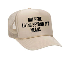 Load image into Gallery viewer, Out Here Living Beyond My Means Trucker Hat
