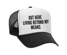 Load image into Gallery viewer, Out Here Living Beyond My Means Trucker Hat
